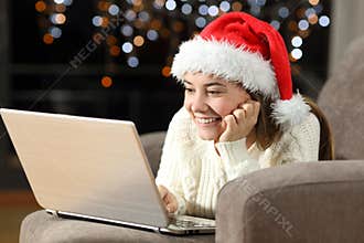 Happy teen watching on line content in christmas