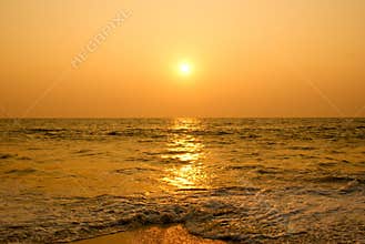Sun setting in a sea beach.