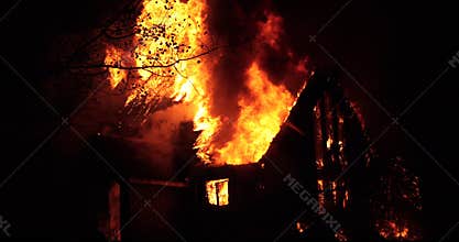 House fire with intense flame.Fully engulfed house fire.