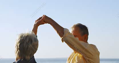 Senior couple dancing at promenade near sea side 4k