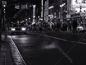 Night scene with a taxi on the street in new york