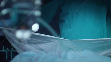 Surgeon hand tearing gauze at surgeon room. Surgeon prepare medical procedure