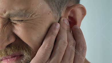 Ageing male has ear ache after catching draft, bacterial infection, otitis pain