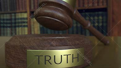 Judge`s gavel falling and hitting the block with TRUTH inscription