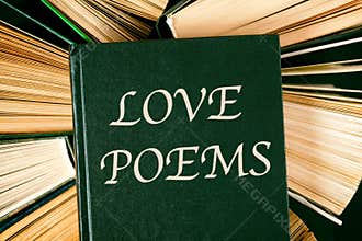 Old hardcover books with book Love Poems on top