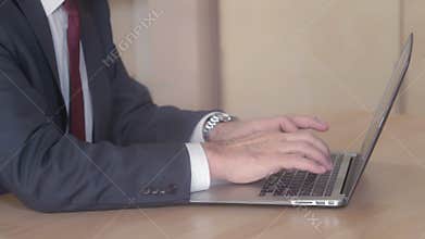 Close up manager body working with pc.