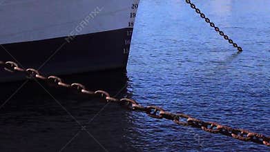 Ship anchor chain in harbour close up