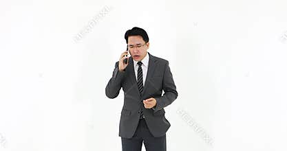 Asian businessman answer the phone.