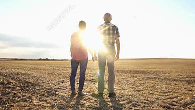Couple of senior woman and man having an evening stroll