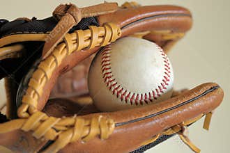 Baseball in leather glove - little league, sports