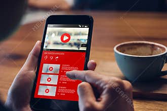 Close up woman hand holding mobile watching video online with advertising on mobile on sofa at home.viral influencer media concept
