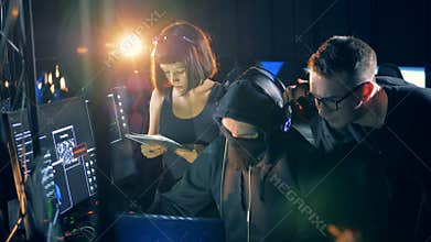 Many hackers work with computers, close up.