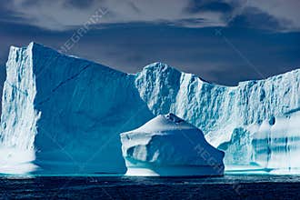 Icebergs in Greenland. Huge Iceberg buildings with tower.
