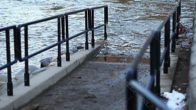 Flood Waters Overtake Walkway with Railing