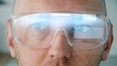 Close up of man in smart glasses with coding