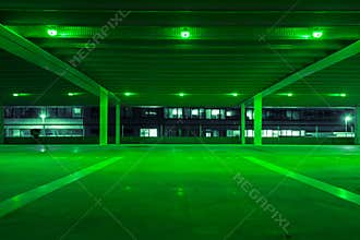 Parking garage with green light in free spots