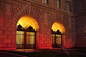Gates silhouetted by warm glow
