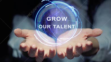 Hands show round hologram Grow our talent