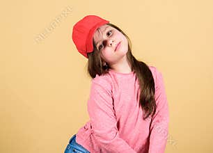 Little girl wearing bright baseball cap. Modern fashion. Kids fashion. Stylish accessory. Feeling confident with this