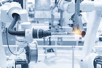 The robotics arm welding the automotive parts.