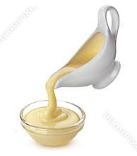Pouring condensed milk isolated on white background