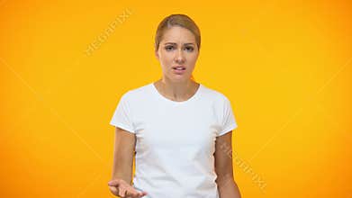 Upset female in white t-shirt swearing, dissatisfied client, problem annoyance