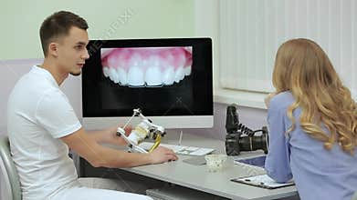 Professional dentist is receiving patient in dental clinic