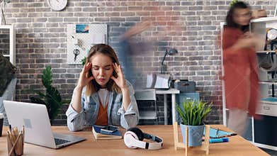 Time-lapse of depressed girl employee sufffering from headache in office