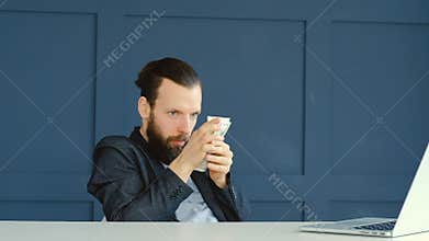 Greedy worried man counting dollars money saving