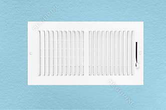Air conditioning and heating vent on wall