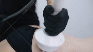 Close up, buttocks of woman during rf lifting procedure in beauty clinic, slow motion
