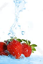 Blurry water being poured on strawberries