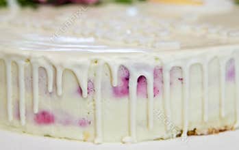Tasty cream birthday cake detail, side view