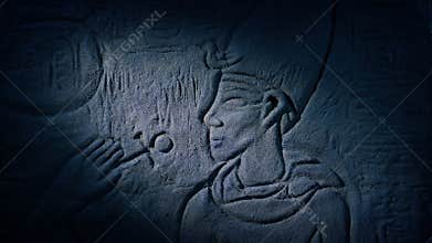 Torch Lights Up Egyptian Carving Of Man