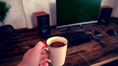 Businessman carrying a cup of espresso coffee