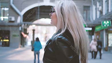 Bye chic urban blonde smiling turning leaving