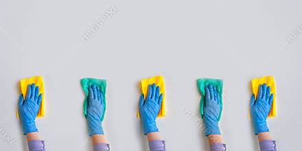 Commercial cleaning company. Employee hands in blue rubber protective glove. General or regular cleanup