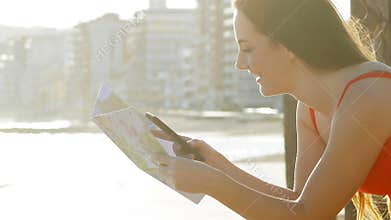 Profile of a tourist checking phone and map