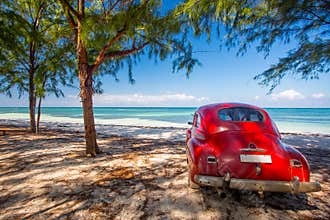 Classic car on a beach in Cuba