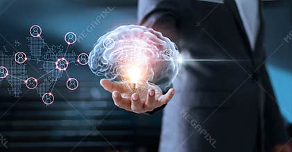 Businessman holding brain and light bulb with global networking