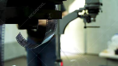 Film roll and device for film development on background. Old photo film rolls, cassette and retro camera on background