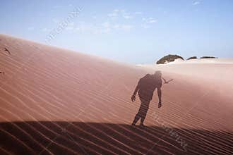 Double exposure of a man in the desert