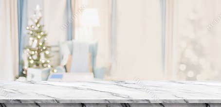 Empty white marble table top with abstract warm living room decor with christmas tree blur background with bokeh light,Holiday ba