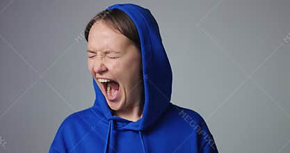 Emotional woman screaming isolated on white