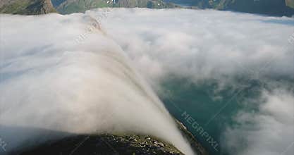 Clouds waterfall in Mountains over fjord Norway nature