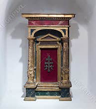 Decorative cross standing in a niche in the prayer room of the Bran Castle in Bran city in Romania