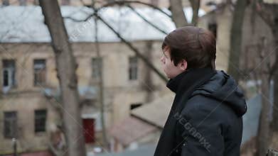 Lonely depressed man looking into distance, feeling guilty, upset with bad news