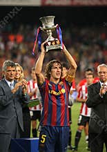Carles Puyol holds up spanish Super cup