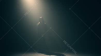 Woman in kimono practicing martial arts with katana
