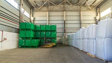 Forklift loader at work timelapse hyperlapse moves green container at warehouse